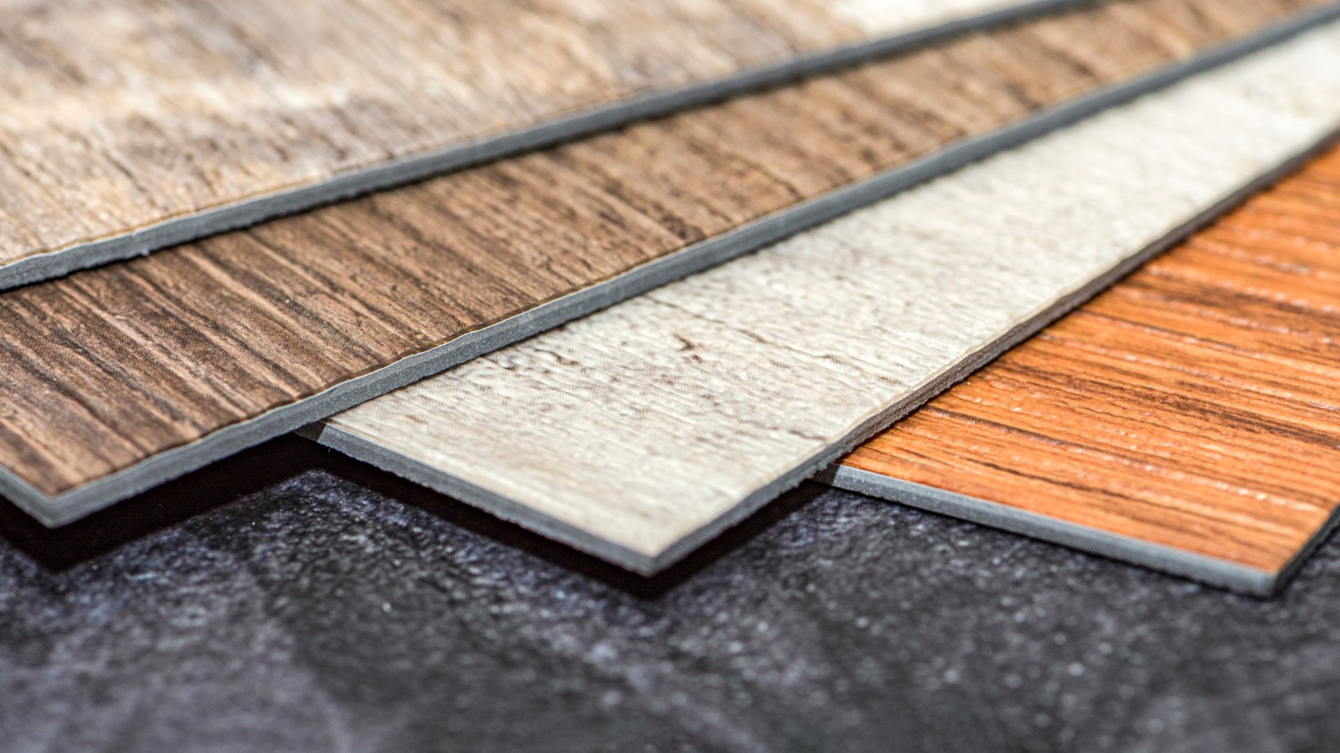 A close up of a variety of wood flooring samples