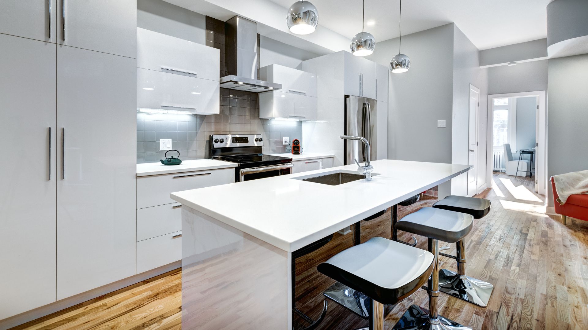 A kitchen with a center island with stools